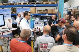 manager training students to use orbital welding machines and power source